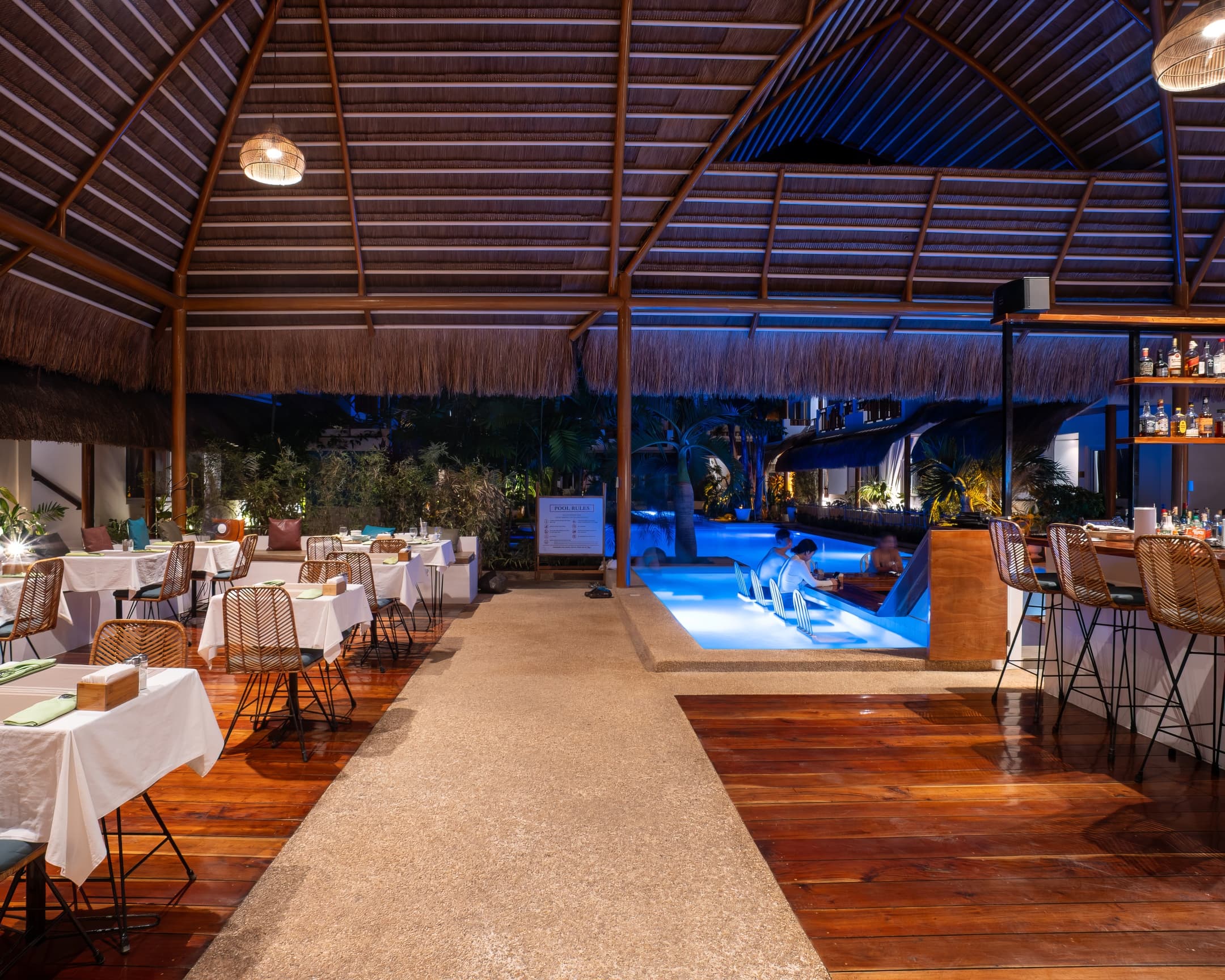Restaurant walkway and poolside dining at Bathala Resort