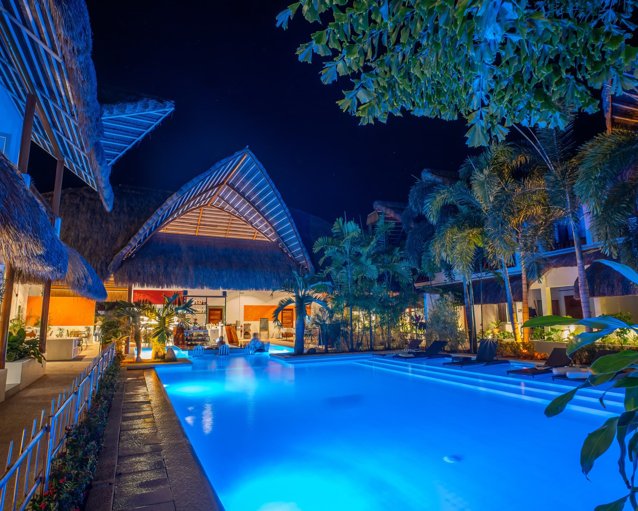 Night pool beside the open-air restaurant at Bathala Resort
