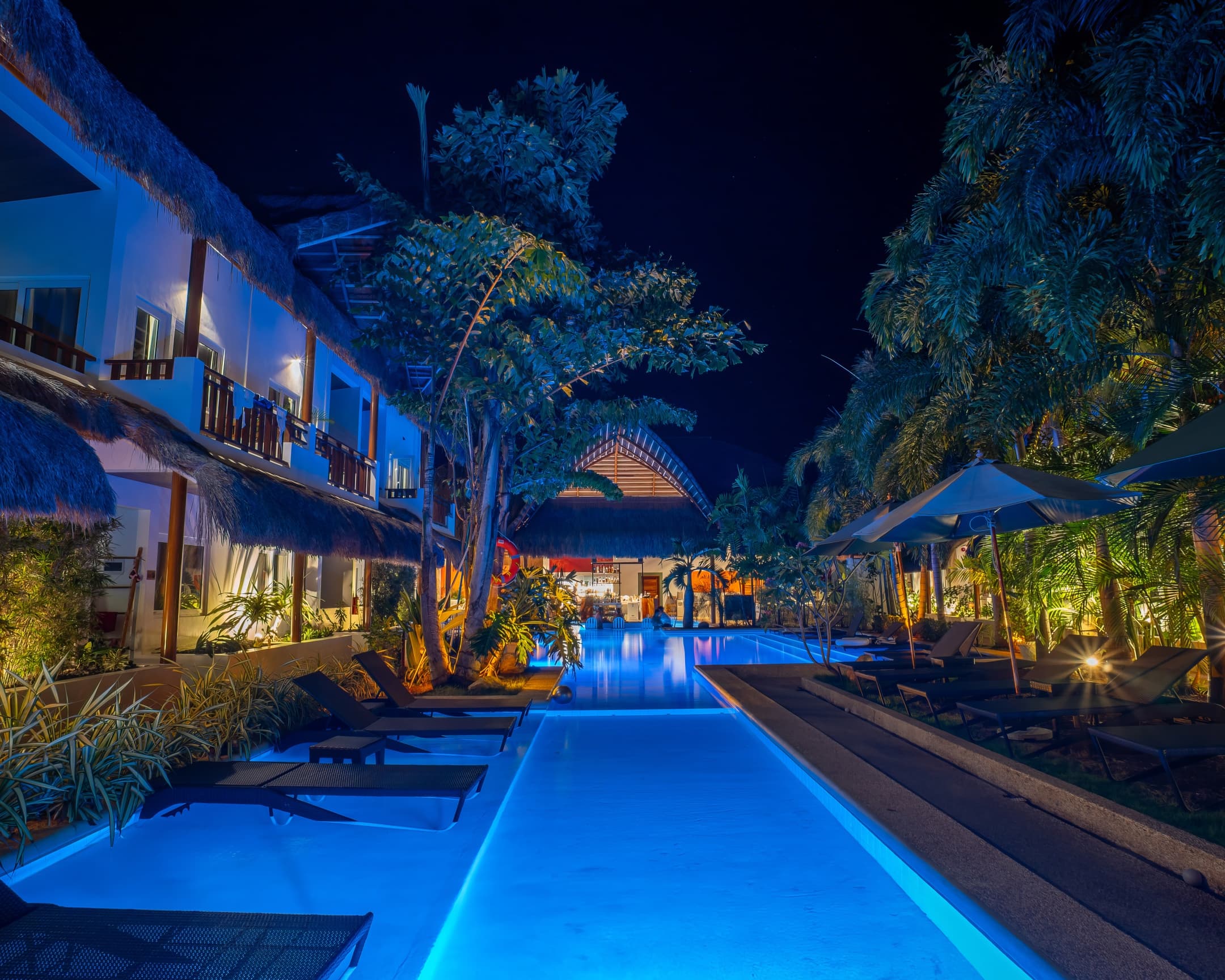 Long evening pool view at Bathala Resort