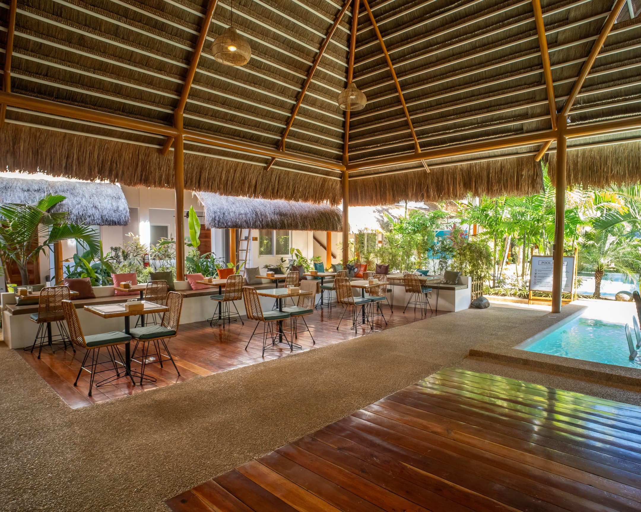 Open-air restaurant beside the pool at Bathala Resort