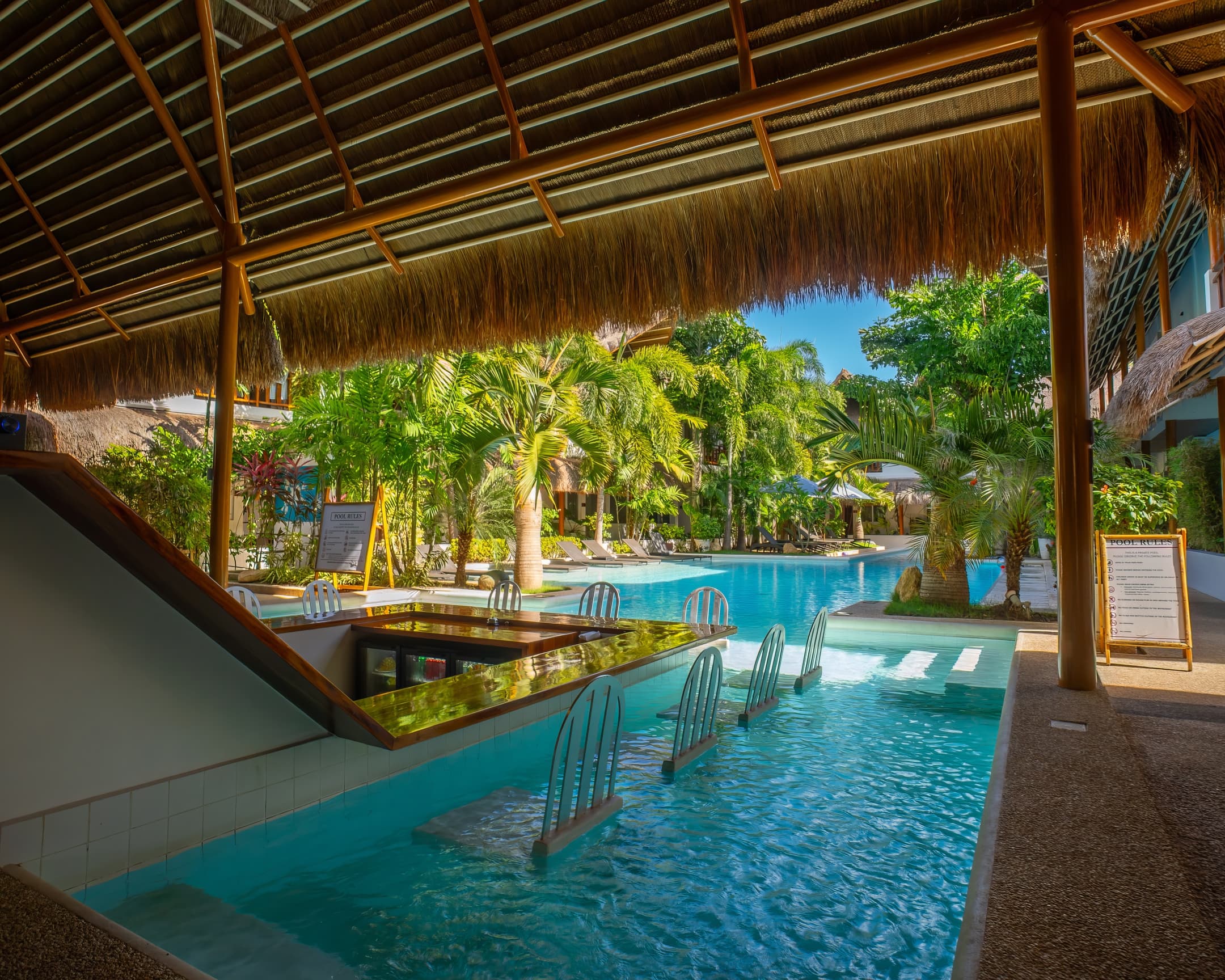 Covered poolside lounge at Bathala Resort