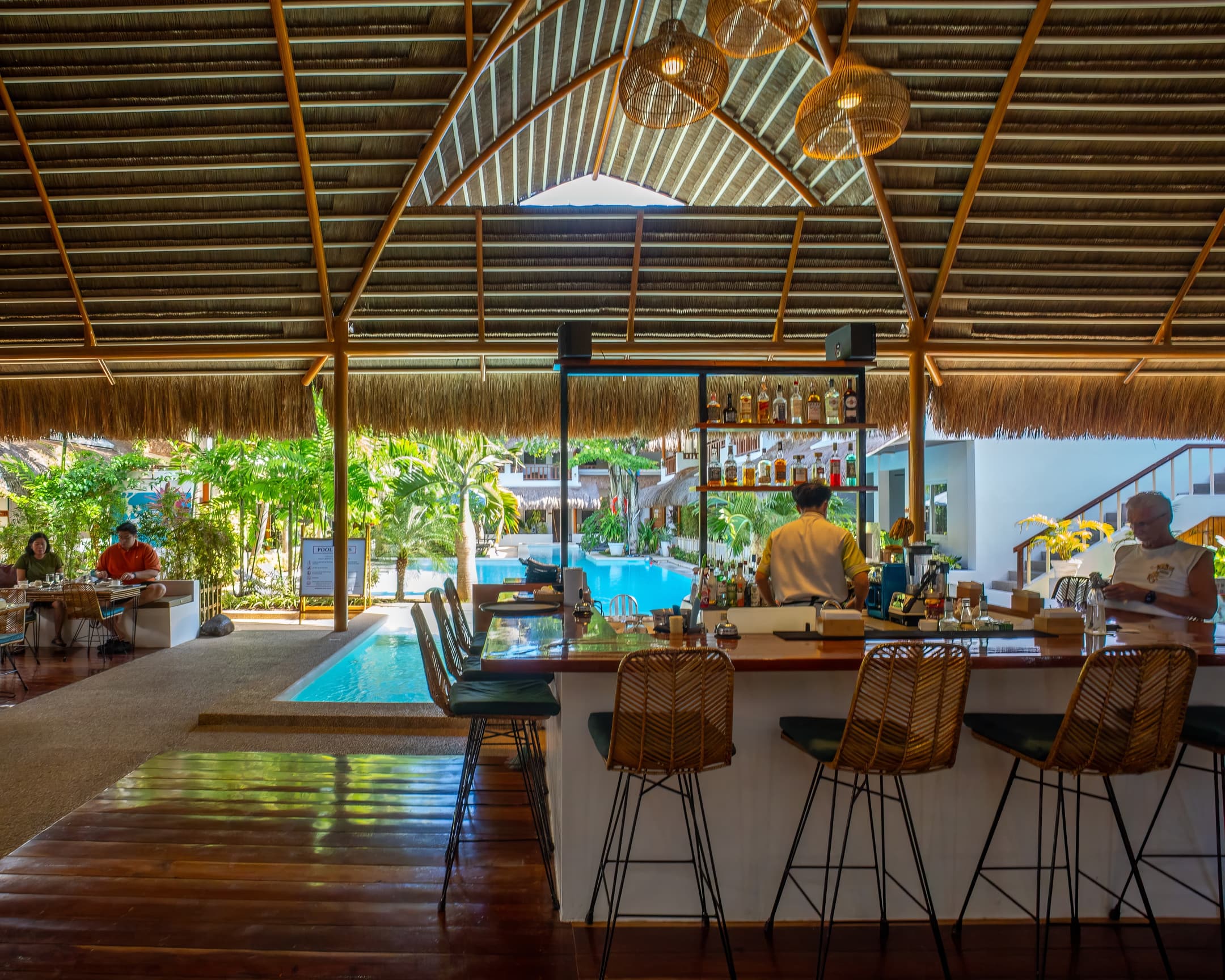 Covered bar looking out to the pool at Bathala Resort